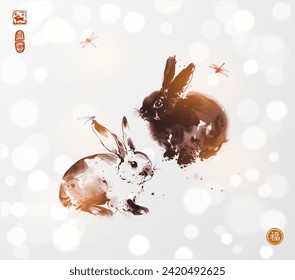 Ink wash painting of rabbits and dragonflies on white shimmering background. Traditional oriental ink painting sumi-e, u-sin, go-hua. Hieroglyph - well-being.
