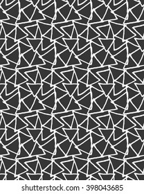 Inked overlapping triangles on black.Hand drawn with ink seamless background.Monochrome rough texture.