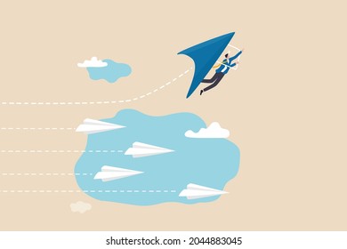 Innovative way to win business competition, think difference or choose our own winning direction, ambition and creativity concept, businessman flying on glider in growth direction to win the challenge