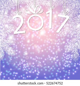 inscription 2017 with fir branches. The numbers in 2017 with New Year's ball.
