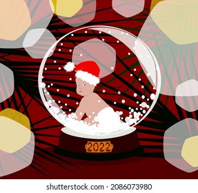 The inscription "2022".A little newborn in a red Santa Claus hat, a diaper. A glass gift ball with a baby, a view from the back. A long-awaited child, make a wish for the new year.