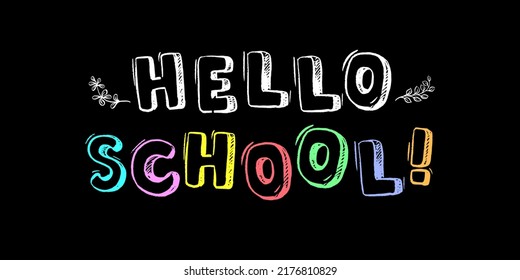 The inscription in colored chalk on the blackboard - Hello school!