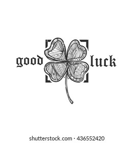 The inscription "good luck" with a beautiful clover doodle. Template for t-shirts, cafe , club, or your design.
