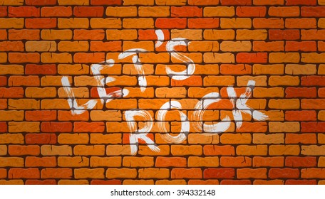 Inscription let's rock on the wall of red brick