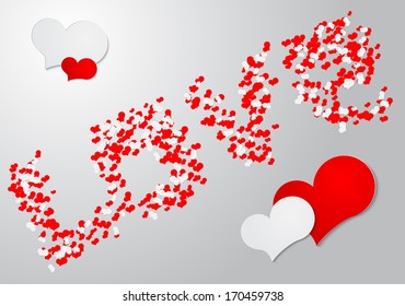 Inscription love of red and white hearts on a gray background