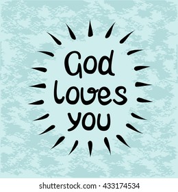 The inscription made by hand God loves you on blue background