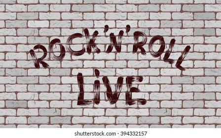 Inscription rock'n'roll live on the wall of white brick