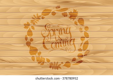 Inscription Spring is coming on wooden background in a frame of transparent leaves. Hand draw, vector illustration. Graphic design.