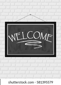 Inscription Welcome written in chalk on a blackboard in a frame hanging on the brick wall background light. Vector illustration.
