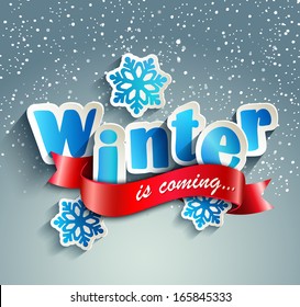 The inscription "Winter is coming" on a snowy background paper style