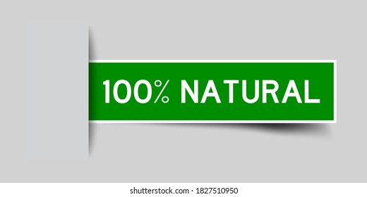 Inserted green color label sticker with word 100 percent natural on gray background