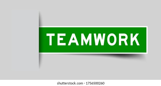 Inserted green color sticker label with word teamwork on gray background