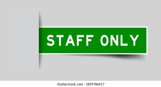 Inserted green color sticker label with word staff only on gray background