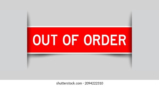 Inserted red color label sticker with word out of order on gray background