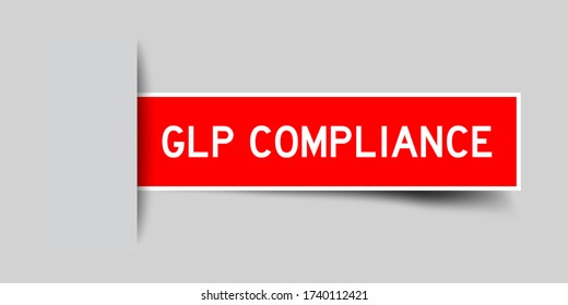 Inserted red color sticker label with word GLP (Good Laboratory Practice) compliance on gray background