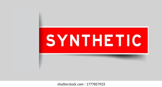 Inserted red color sticker label with word synthetic on gray background