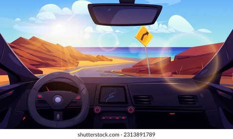 Inside car view on desert road to sea shore landscape. Turn sign on highway for direction drive to ocean beach coast. Steering control with navigation interface and windscreen scene on water and rock