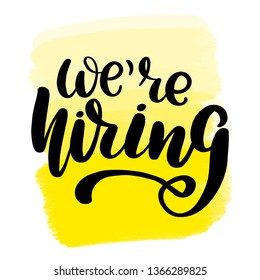 Inspirational handwritten brush lettering we're hiring. Yellow watercolor stain on background.