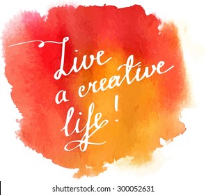 Inspirational phrase 'Live a creative life' in handwriting on a bright watercolor background texture, scalable vector graphic