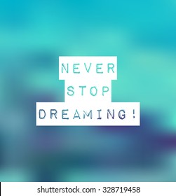Inspirational text Never stop dreaming on blur background. Vector