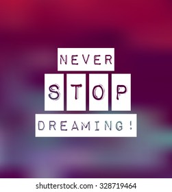 Inspirational text Never stop dreaming on blur violet background. Vector