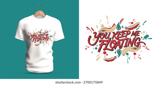 Inspirational vector t-shirt design featuring the phrase You Keep Me Floating with splashes of red and teal, expressive brush lettering, and dynamic movement. A modern conceptual artwork symbolizing