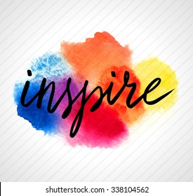 Inspire hand lettering on splash bright watercolor background. Vector illustration