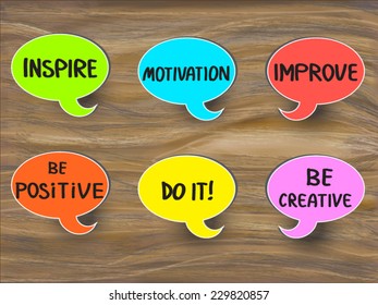 Inspire, improve, be positive, be creative, do it motivational concept illustration. A set of multicolor speech bubble sticker with handwritten reminders. On vector wooden desk background. EPS 10.