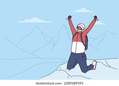 Inspired traveler man stands on mountaintop rejoicing at successful climbing Everest peak or new world record. Male tourist raises hands as sign of victory after climbing on hard to reach place