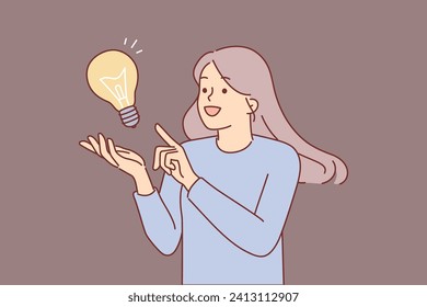 Inspired woman comes up with idea to save energy resources and provide bright lighting, stands near giant lamp. Girl says eureka after learning about new promising idea for self-development