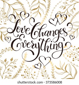 Inspiring lettering black on white with golden branches on background. Love changes everything. Romantic quote . Modern calligraphy for T-shirt and postcard design. 