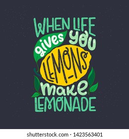 Inspiring lettering saying When Life Gives You Lemons Make Lemonade on black chalkboard. Green and yellow hand drawn inscription with citrus fruit and leaves. Sunny phrase for poster, apparel, print