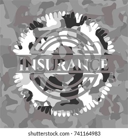 Insurance on grey camouflaged texture