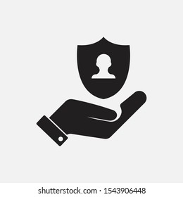 Insurance shield with user icon in a hand. Shield protection vector icon.Privacy icon. Authentication security . Filled vector icon