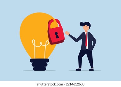 Intellectual property, patented protection, businessman owner standing with light bulb idea locked with padlock for patents.