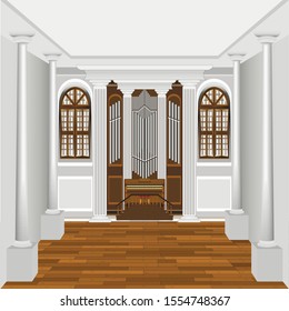 interior of a hall with a keyboard organ with pipes