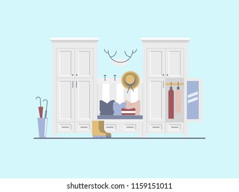 Interior of the hallway of the house in a modern style. Cabinets for outer clothing, bench with storage of shoes. Basket for umbrellas, hooks for hats. Decor in the hunting style.