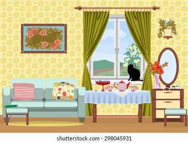 Interior living room, on the desk and a cup of tea. Cat looking out the window.