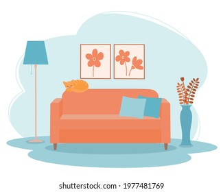 Interior of the living room with a sofa and a red cat.