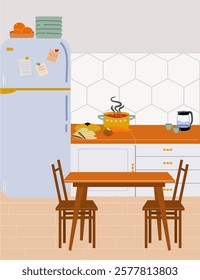 The interior of a modern, cozy kitchen with a refrigerator, countertop and dining table. 