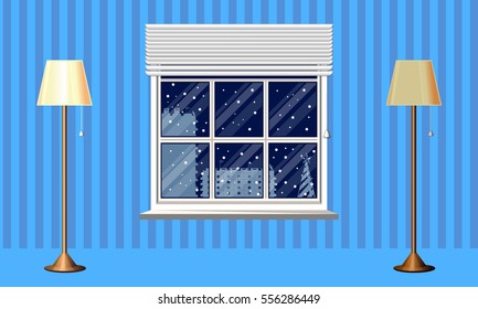 The interior of the room. Night time . Landscape outside the window. Silhouette of a house, tree. Floor lamp. The light is turned on. The lights are turned off . Template for your design.