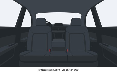 Interior view of a car back seat looking forward towards the dashboard with dark gray upholstery and neutral color palette.