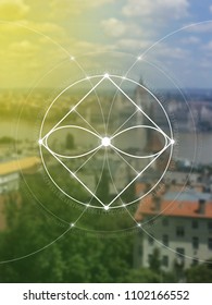 Interlocking circles, triangles and eternity sign hipster sacred geometry illustration with golden ratio digits and light dots in front of photographic background.