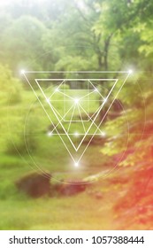 Interlocking circles and triangles sacred geometry illustration with golden ratio digits in front of photographic background.