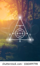 Interlocking circles and triangles sacred geometry illustration with golden ratio digits in front of photographic background.