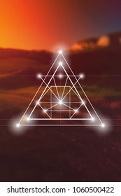Interlocking circles and triangles sacred geometry illustration with golden ratio digits in front of photographic background.

