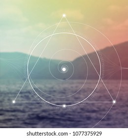 Interlocking circles, triangles and spirals hipster sacred geometry illustration with golden ratio digits in front of photographic background.