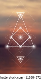 Interlocking circles, triangles and squares hipster sacred geometry illustration with flower ornament and  light dots in front of photographic background.