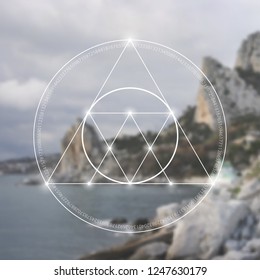 Interlocking circles, triangles and squares hipster sacred geometry illustration with light dots in front of photographic background.