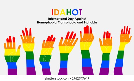 The International Day Against Homophobia, Transphobia and Biphobia. Hands raised in the air decorated in the colors of the LGBT flag. Template for background, banner, card poster with text.